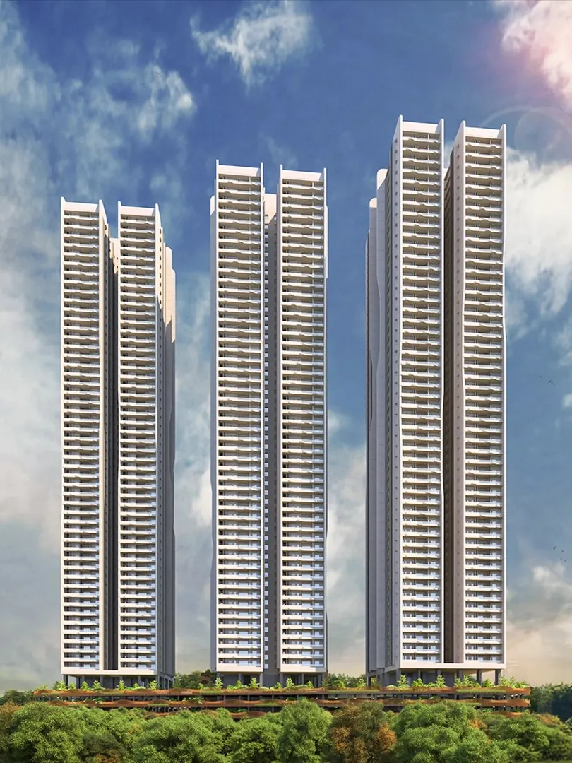Three slender apartment towers against a bright sky at Aparna Sarovar Towers