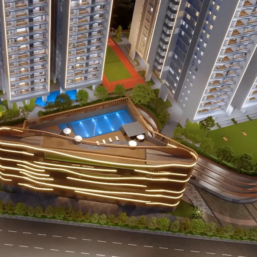 An aerial view of the clubhouse podium, its rooftop pool and sports courts at Aparna Sarovar Towers